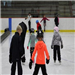 Learn to Skate participants helping each other