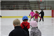 Learn to Skate participants show off their helmets