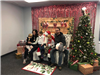 People posing with Santa