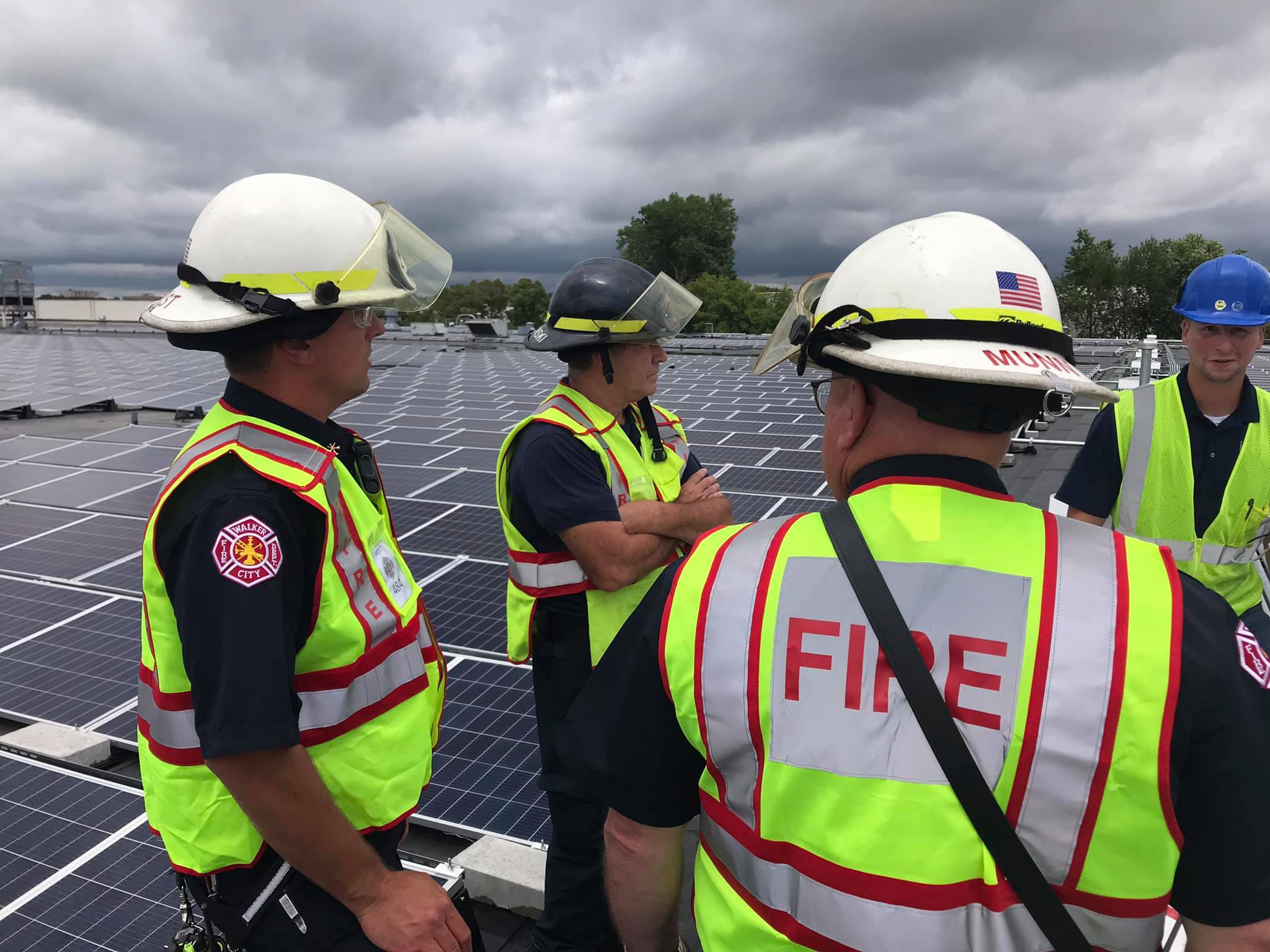 Firefighters on roof of building