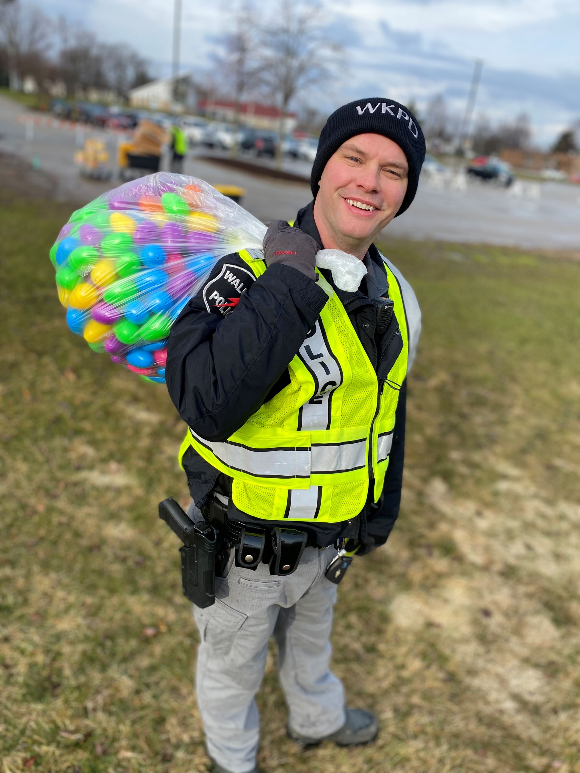 Walker Police Officer carrying eggs in park